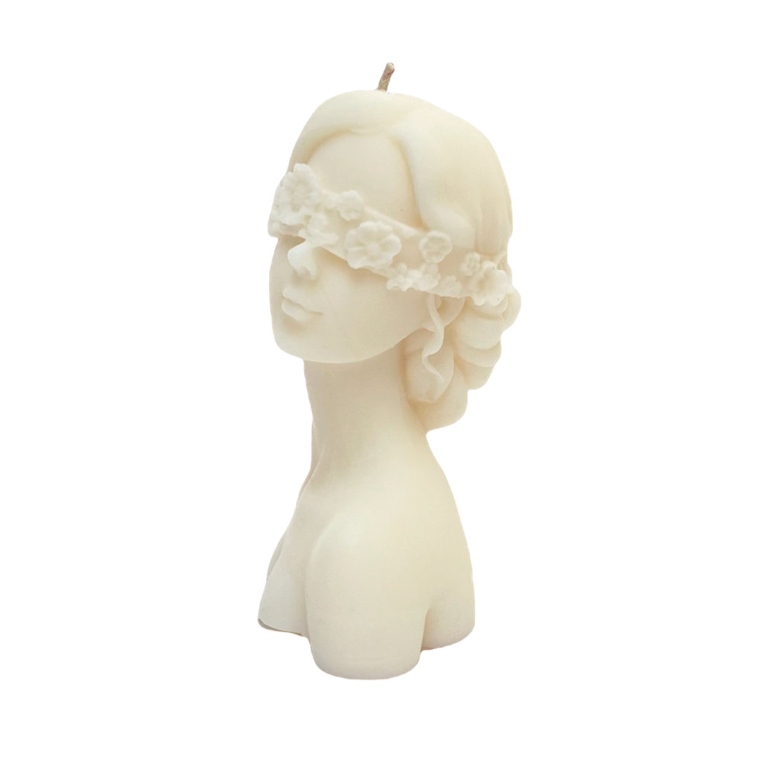 vela de soya forma de rostro de mujer con ojos cubiertos