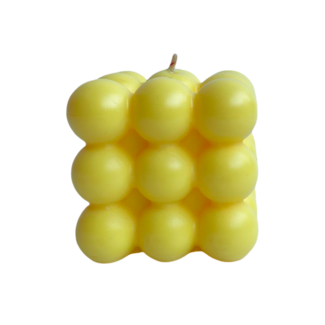 vela de soya cubo burbuja color amarilla