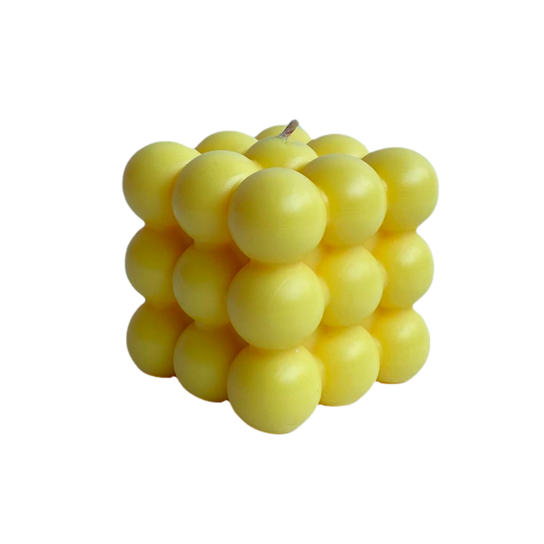vela soya forma cubo burbuja color amarilla