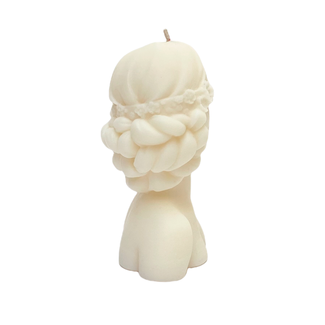 vela de soya en forma de rostro de mujer con ojos cubiertos