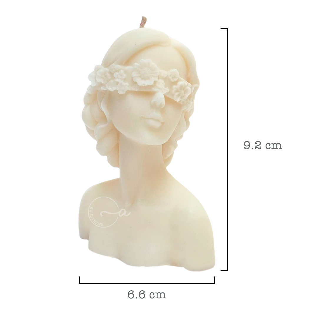 vela de soya forma de rostro de mujer con ojos cubiertos