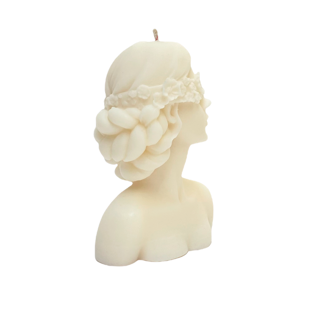 vela de soya en forma de rostro de mujer con ojos tapados