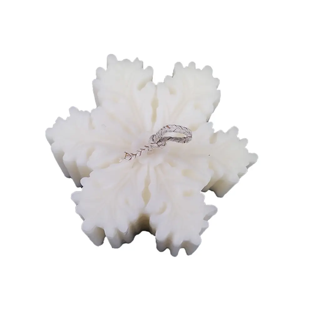 vela de soya en forma de copo de nieve